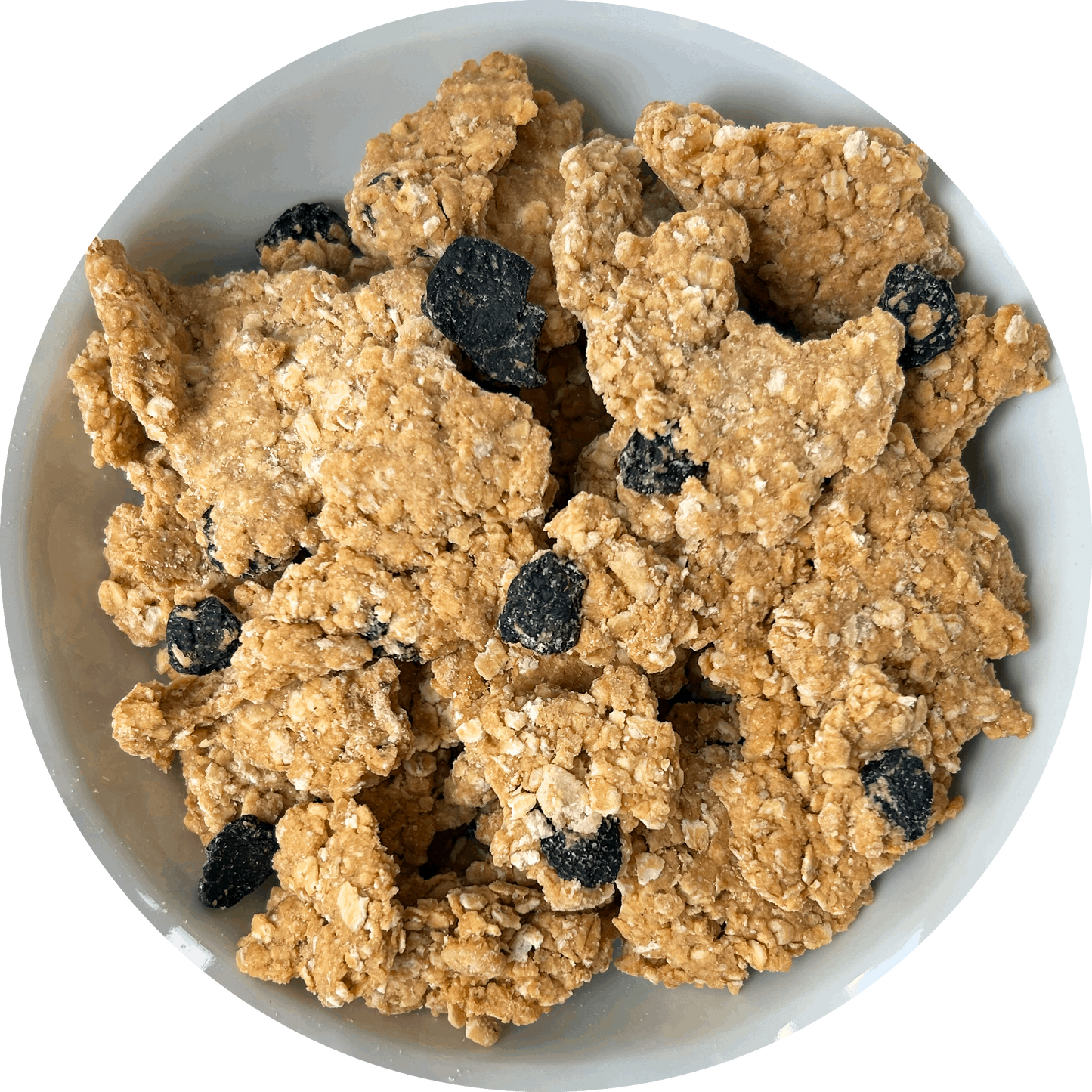 Image: A tempting bowl of Cherry Bakewell granola. The granola features large, chunky almond-flavored pieces that promise a satisfying crunch. Scattered throughout the mix, you can see tangy, sour dried cherries, adding a burst of fruity sweetness. The granola is reminiscent of the classic Cherry Bakewell dessert, with the delightful combination of almond and cherry flavors.
