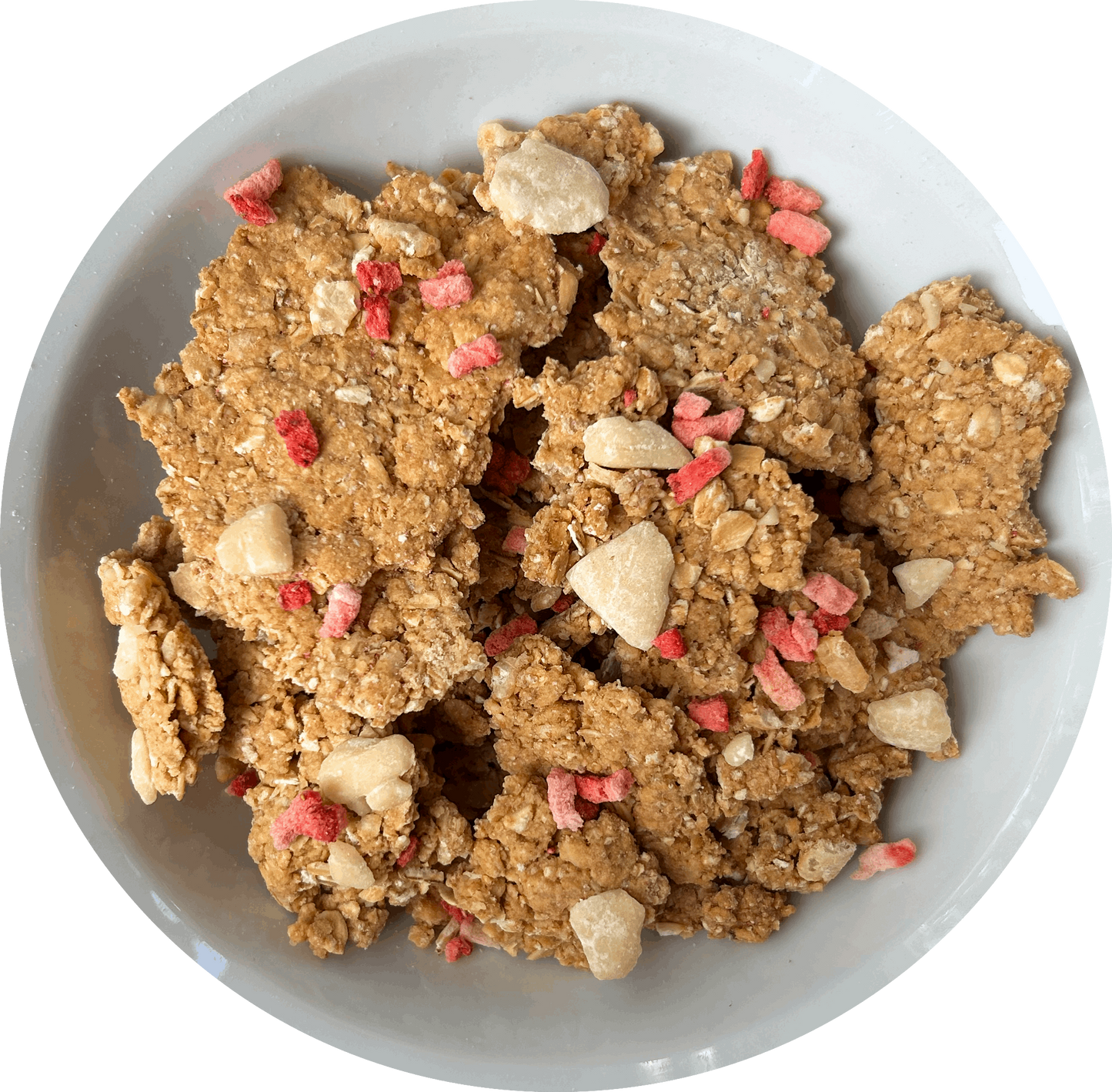 Image: A tempting bowl of Victoria Sponge granola, showcasing large, chunky pieces generously adorned with vegan white chocolate chips and scattered freeze-dried strawberry slices on top. The granola promises a satisfying crunch, while the white chocolate chips add a creamy sweetness. The vibrant red freeze-dried strawberries provide a burst of fruity flavor, reminiscent of the classic Victoria Sponge cake.
